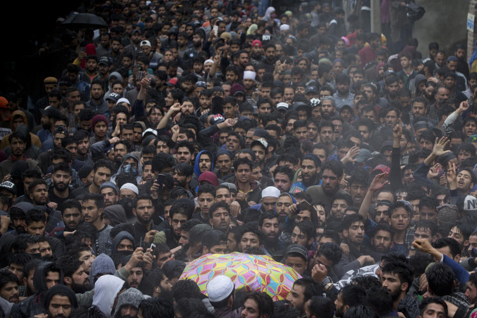 Kashmiri villagers participate in the funeral procession of Zakir Musa, a top militant commander linked to al-Qaida, as it rains in Tral, south of Srinagar, Indian controlled Kashmir, Friday, May 24, 2019. Musa was killed Thursday evening in a gunfight after police and soldiers launched a counterinsurgency operation in the southern Tral area, said Col. Rajesh Kalia, an Indian army spokesman. (AP Photo/Dar Yasin)
