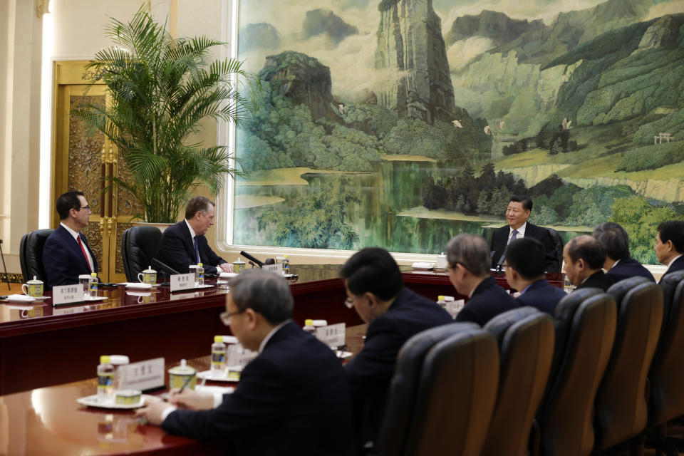 U.S. Trade Representative Robert Lighthizer, second from left, speaks with Chinese President Xi Jinping, next to U.S. Treasury Secretary Steven Mnuchin, left, during a meeting at the Great Hall of the People in Beijing, Friday, Feb. 15, 2019. (AP Photo/Andy Wong, Pool)