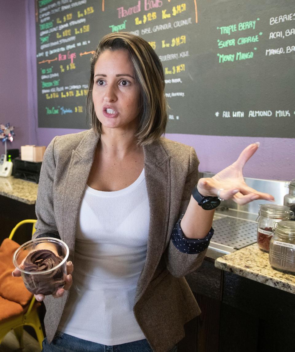 Acai Bowls Tropical Fusion owner Wilmary Amaya describes the benefits of her Acai bowls while opening her Gulf Breeze store on Wednesday, Jan. 18, 2023. Amaya will open a second location at the Garden in downtown Pensacola within the next few days. 