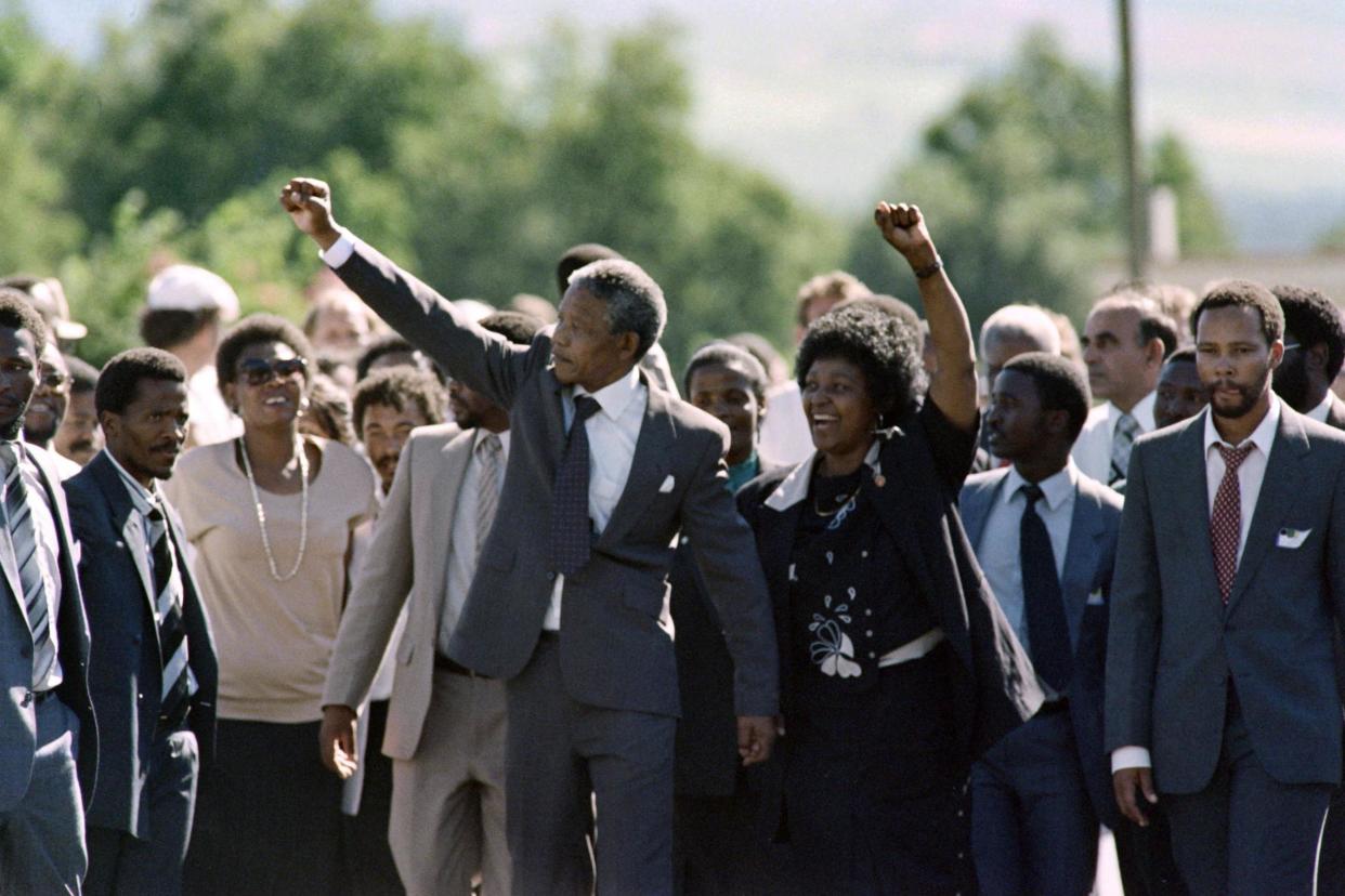 Freedom: Nelson Mandela and his wife anti-apartheid campaigner Winnie Madikizela-Mandela on his release from prison in 1990: AFP/Getty Images