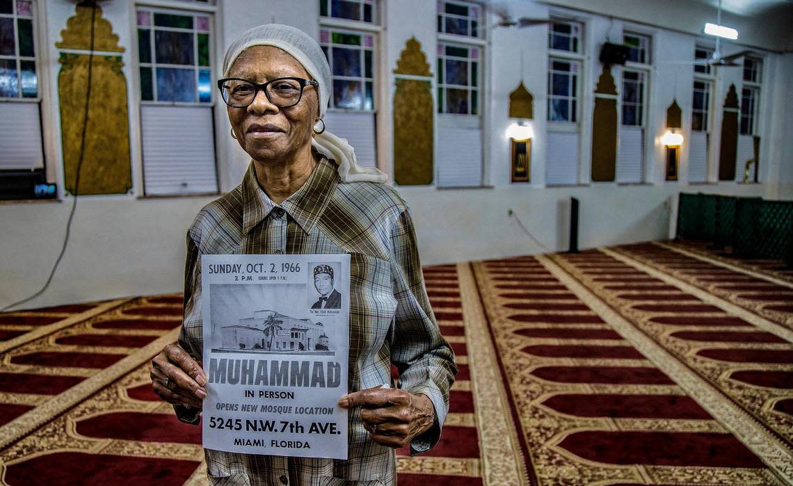 Mattie Collins, a member of the Masjid Al-Ansar community since the 1960s, holds a copy of the original poster announcing the opening the Masjid Al-Ansar building during the Ramadan open house on Thursday, April 6, 2023. Masjid Al-Ansar is the oldest mosque in Florida.