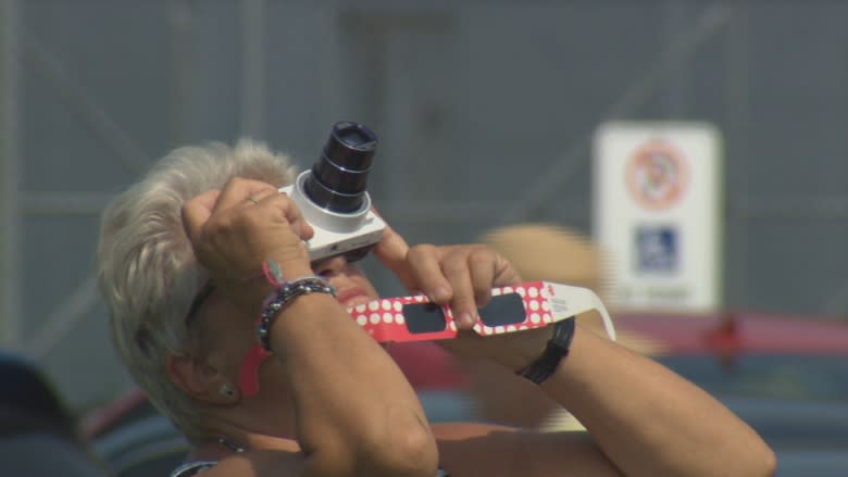 Chance to view partial solar eclipse draws thousands to aviation museum