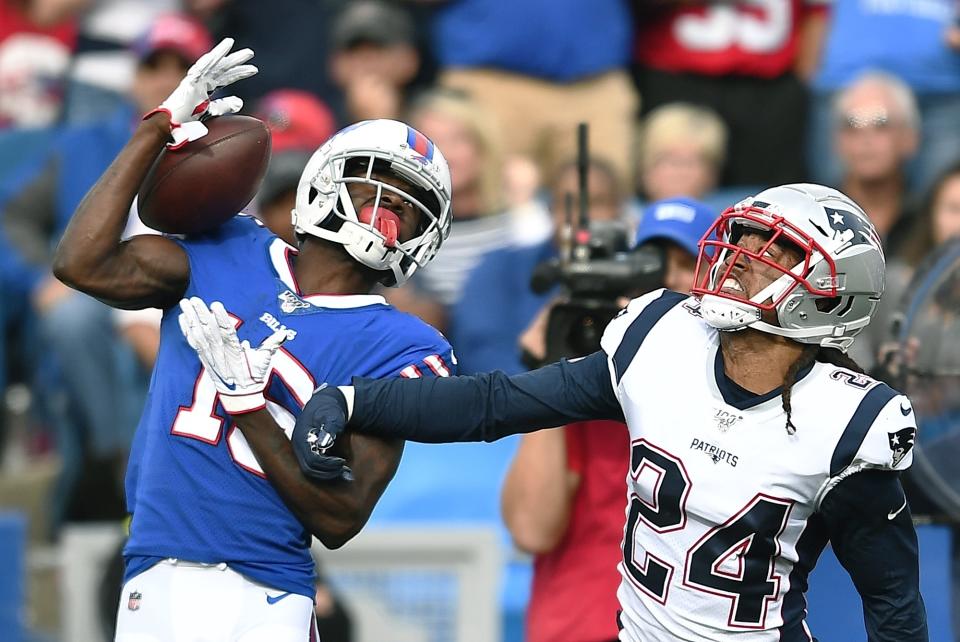 Buffalo Bills wide receiver John Brown catches a pass in front of New England Patriots cornerback Stephon Gilmore (24) in the second half of an NFL football game, Sunday, Sept. 29, 2019, in Orchard Park, N.Y. (AP Photo/Adrian Kraus)