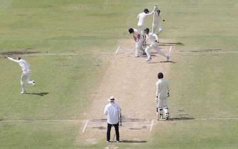 Australia's Steve Smith celebrates after taking the catch to dismiss England's Joe Root off the bowling of Nathan Lyon - Credit: PA