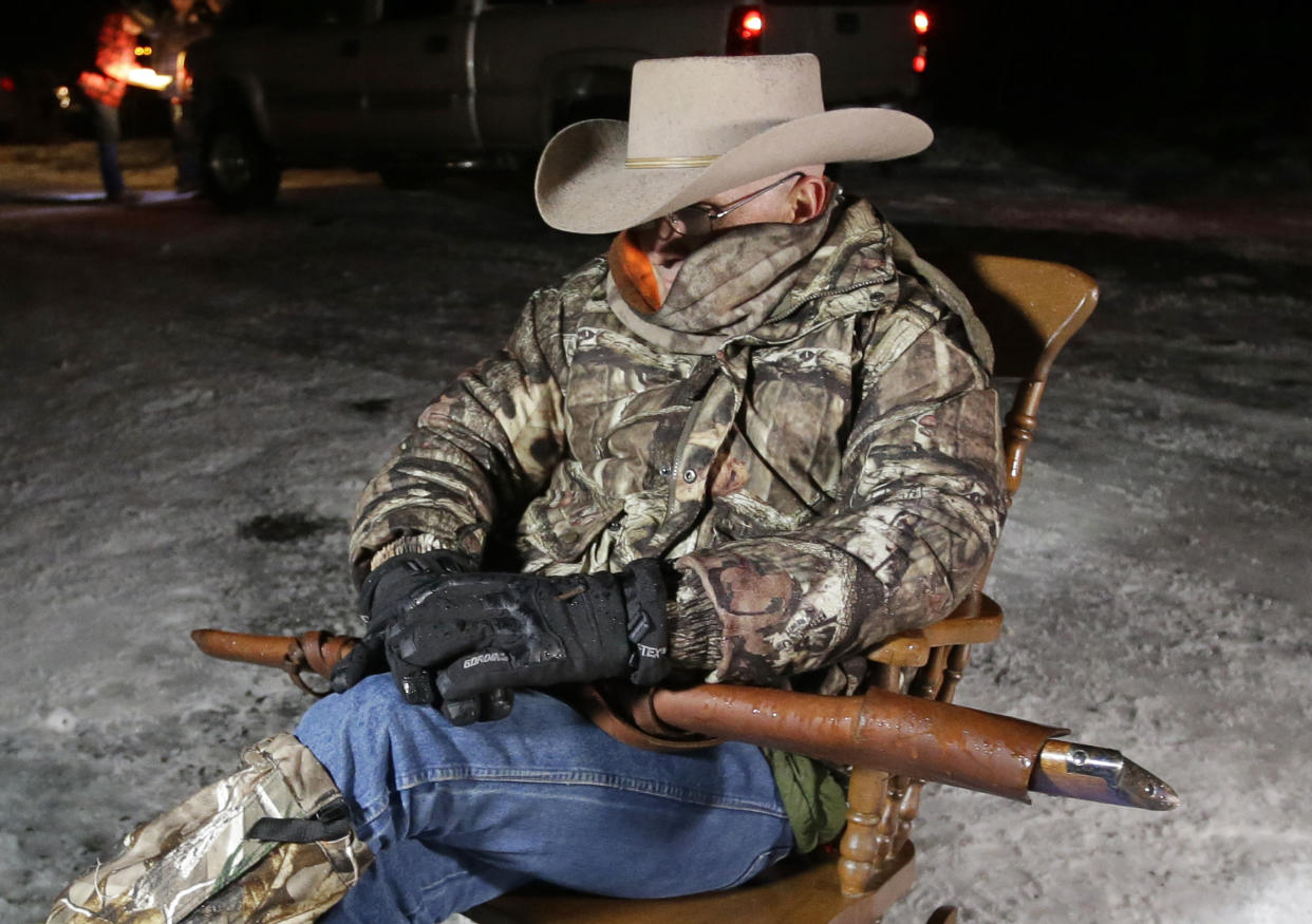 FILE - Arizona rancher LaVoy Finicum, holds a rifle as he guards the Malheur National Wildlife Refuge near Burns, Ore., on Jan. 5, 2016. Over the past decade, Oregon experienced the sixth-highest number of extremist incidents in the nation, despite being 27th in population, according to an Oregon Secretary of State report. Now, the state Legislature is considering a bill that, experts say, would create the nation's most comprehensive law against paramilitary activity. (AP Photo/Rick Bowmer, File)