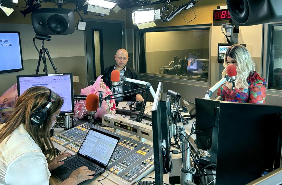 'Levantate' radio show co-hosts María Elena Nava, left, and Denise Reyes, right, talk with producer Robert Isaac.