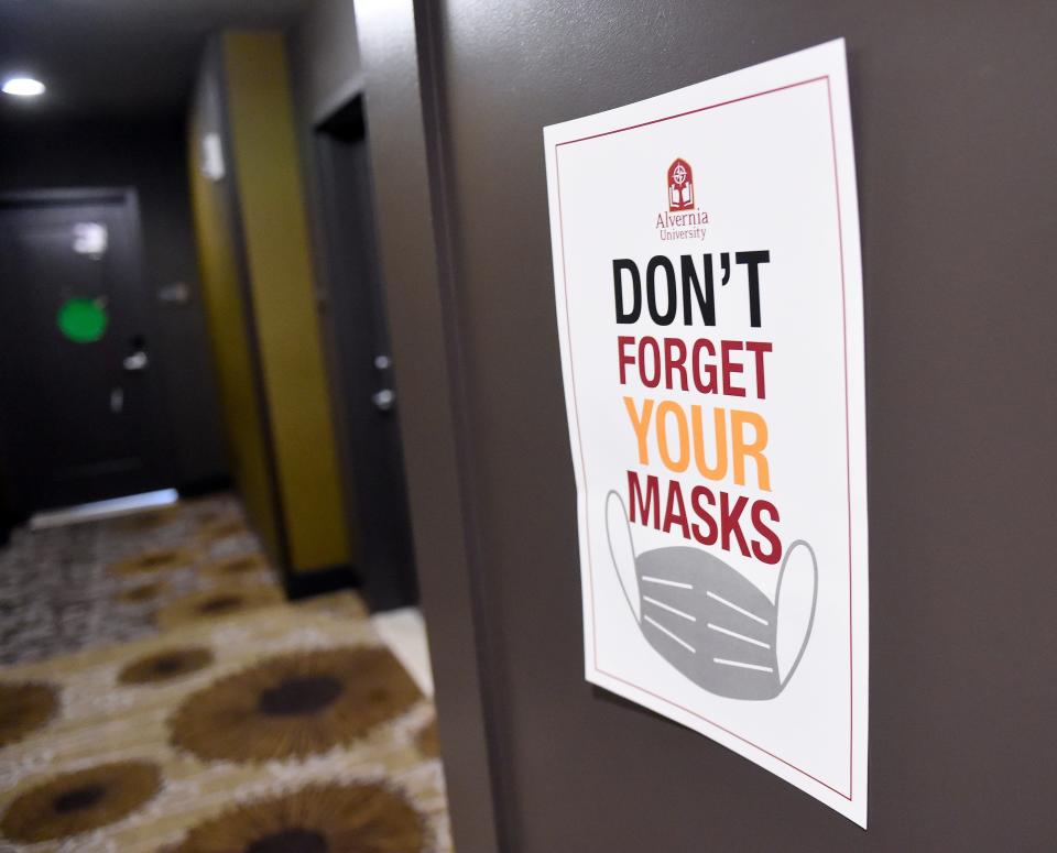 wear a mask sign in a college dorm