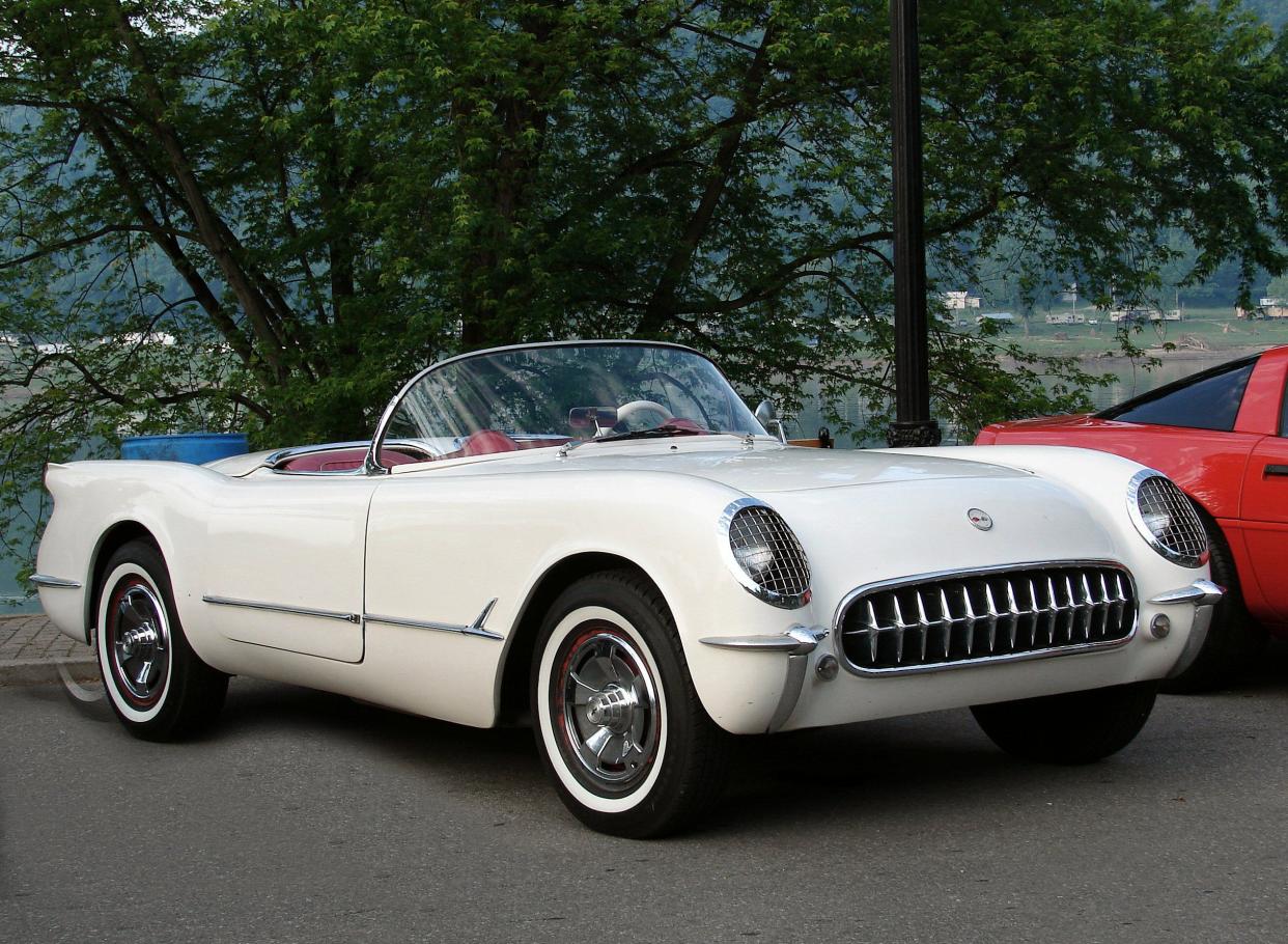 White 1953 Corvette in parking lot in summer