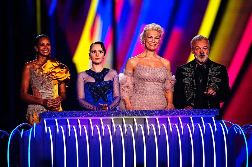 Hosts (left to right) Alesha Dixon, Julia Sanina and Hannah Waddingham, with commentator Graham Norton in the grand final for the Eurovision Song Contest 2023