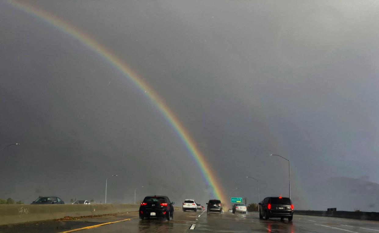 A rainbow appears near Dawson Drive and southbound Highway 101 in Camarillo on Feb. 25. An incoming storm is expected to bring about an inch of rain to Ventura County on Friday.