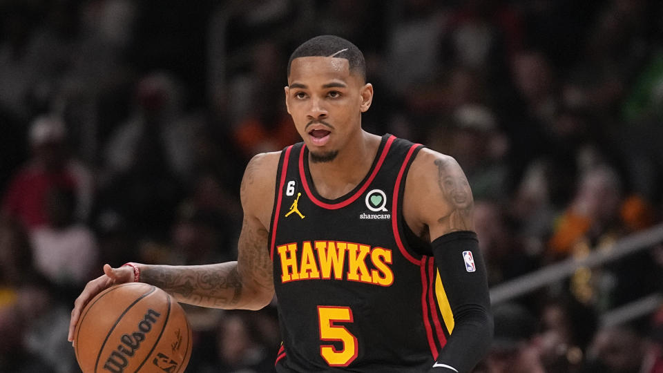 Dejounte Murray bumped into an official on his way off the court Sunday. (AP Photo/Brynn Anderson)