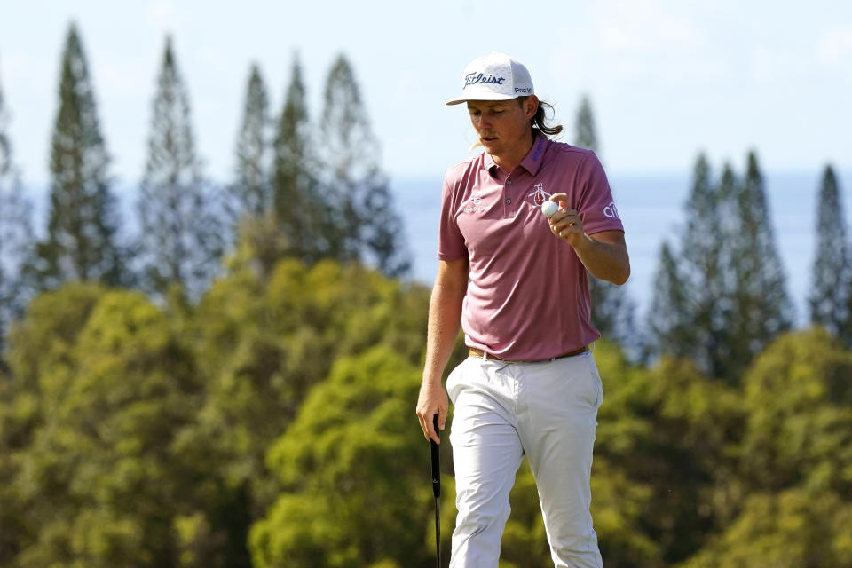 Cameron Smith wavs after making birdie on the 13th green during the final round of the Tournament of Champions golf event, Sunday, Jan. 9, 2022, at Kapalua Plantation Course in Kapalua, Hawaii. (AP Photo/Matt York)