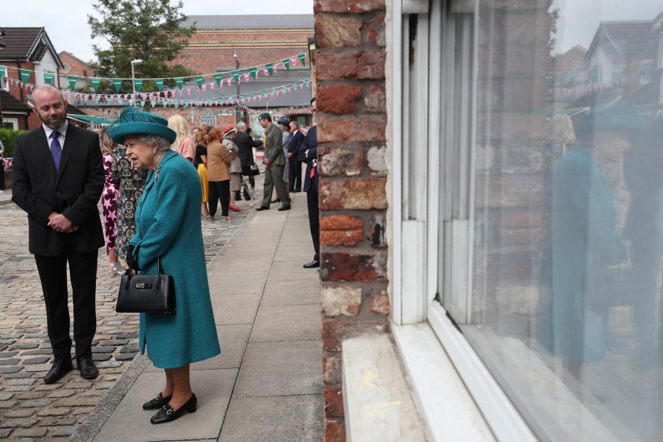 Britain's Queen Elizabeth II visits the set of the long running television series Coronation Street, in Manchester, England, Thursday July 8, 2021. (AP Photo/Scott Heppell)