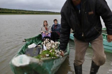 The Wider Image: Russian village's last teacher stays on for her one remaining pupil