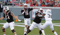 North Carolina State quarterback Bailey Hockman (16) throws a pass during the first half of the team's NCAA college football game Georgia Tech in Raleigh, N.C., Saturday, Dec. 5, 2020. (Ethan Hyman/The News & Observer via AP, Pool)