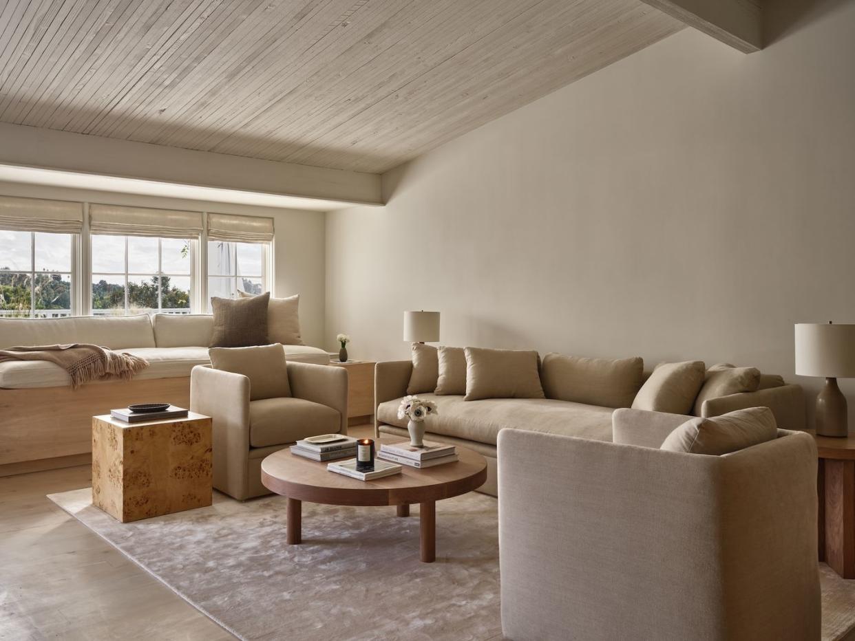 a living room with a couch and coffee table