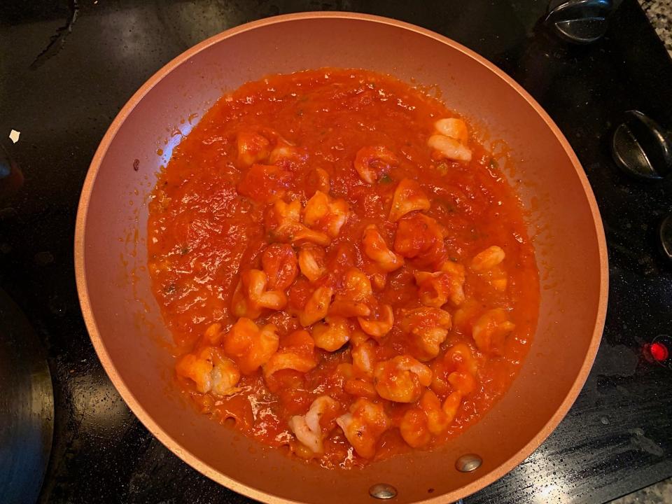 The shrimp with Carbone sauce added in the pan