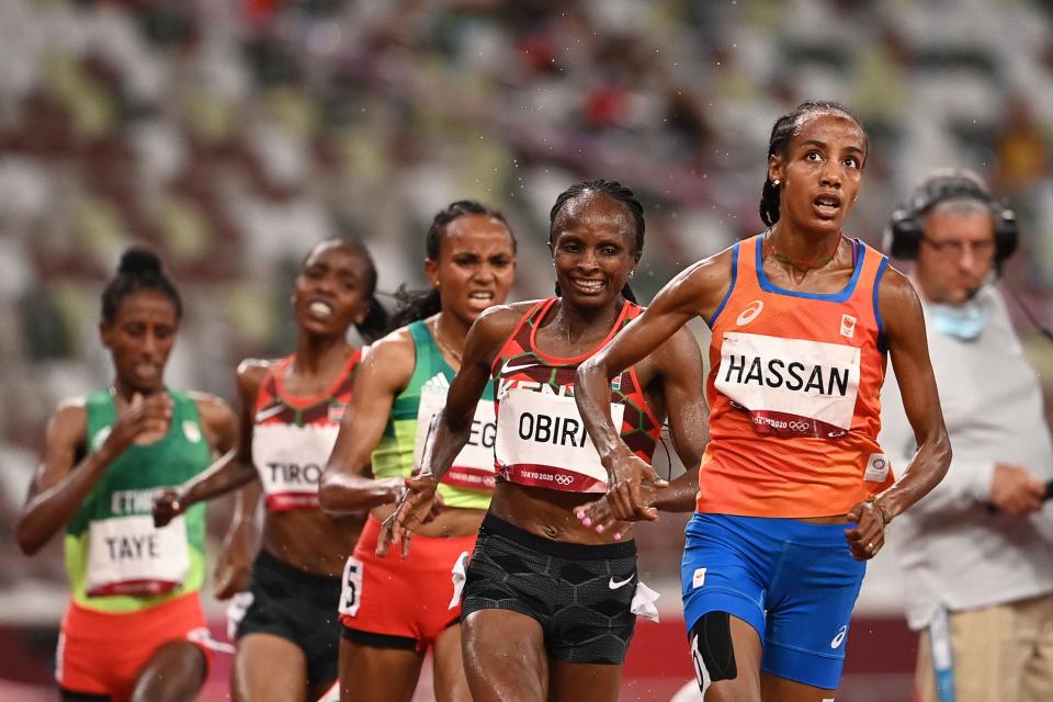 Hassan leading in the 5,000m final (AFP)