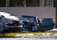 FILE - A Chevrolet Corvette is shown at the scene of a fatal crash on South Rainbow Boulevard between Tropicana Avenue and Flamingo Road in Las Vegas, Tuesday, Nov. 2, 2021. Former Las Vegas Raiders player Henry Ruggs was sentenced Wednesday, Aug. 9, 2023, in Las Vegas, to at least three years in a Nevada prison for killing a woman in a fiery crash while driving his sports car drunk at speeds up to 156 mph on a city street nearly two years ago. (Steve Marcus/Las Vegas Sun via AP, File)