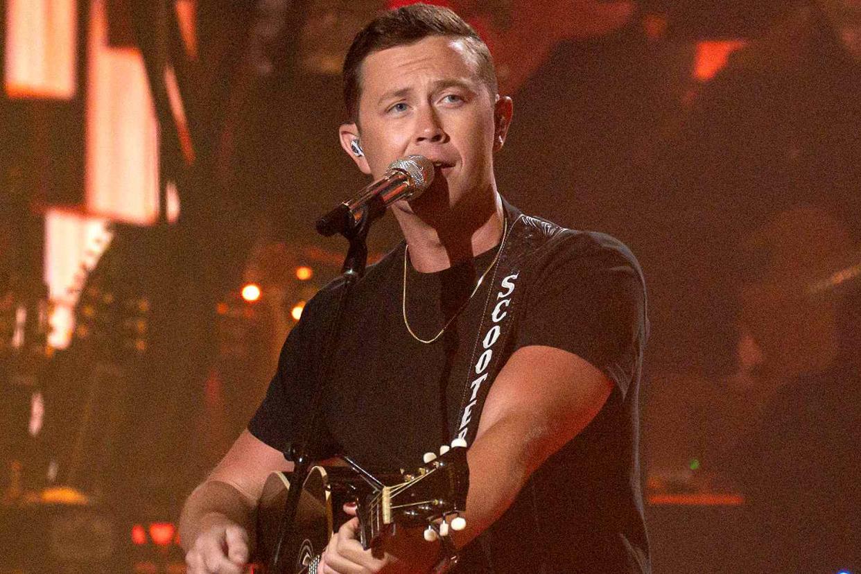 <p>Eric McCandless/Disney</p> Scotty McCreery on April 28, 2024