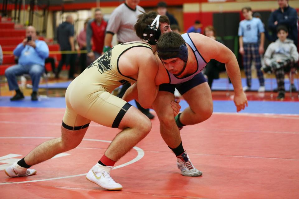 Suffern's Yiorgos Georgas and Clarkstown North's Brian Bordas wrestle in the 215-pound weight class during the Rockland County wrestling championship at Tappan Zee High School Jan. 21, 2023. 