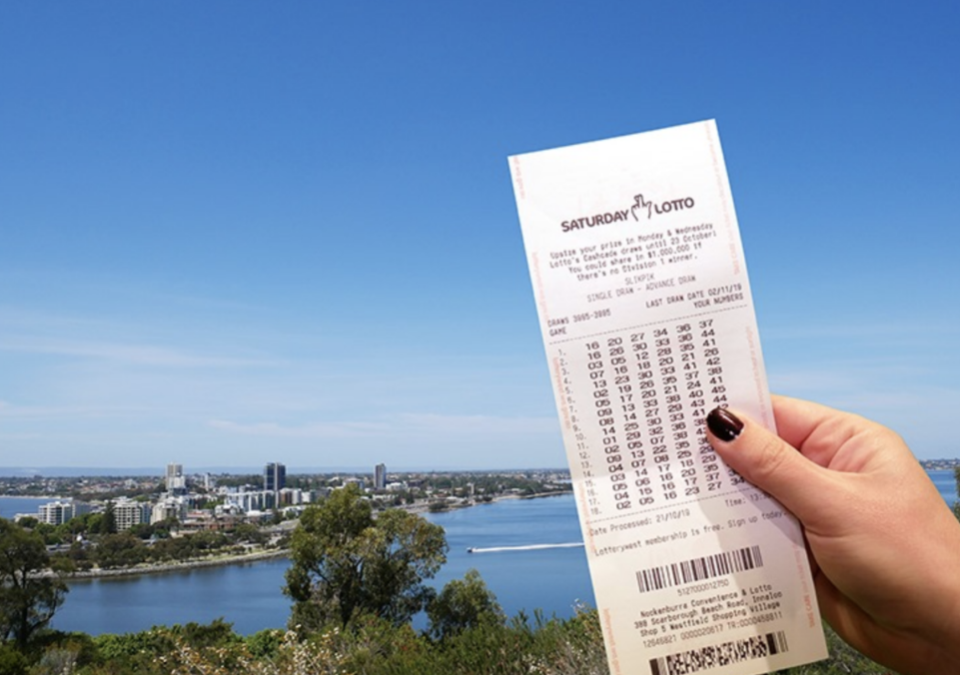 Pictured is a woman's hand holding a Saturday Lotto ticket. There have been six WA division one winners since the start of 2020.