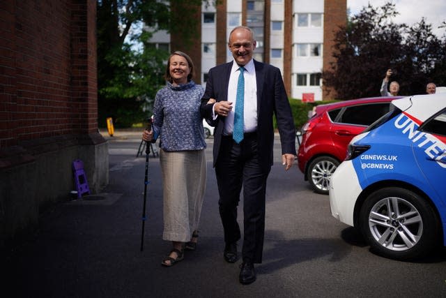 Liberal Democrat leader Sir Ed Davey and his wife Emily arrive to cast their votes at Surbiton Hill Methodist Church