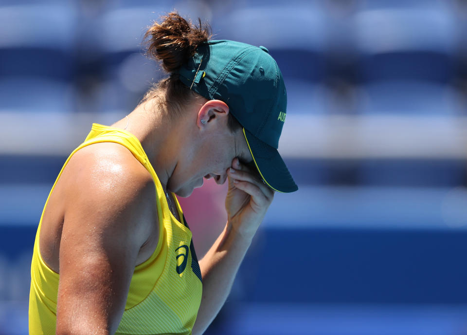 Australia's world No.1 tennis player Ashleigh Barty shows her frustration during her Tokyo Olympics women's singles first-round loss against Sara Sorribes Tormo of Spain. (
