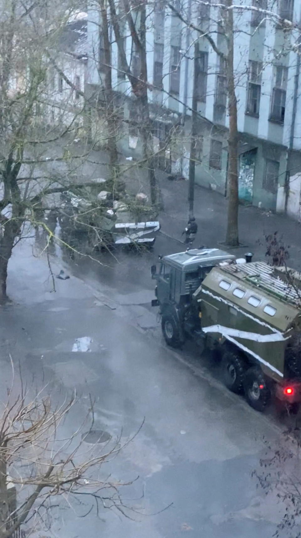 A military truck and tank are seen on a street of Kherson on March 1. 