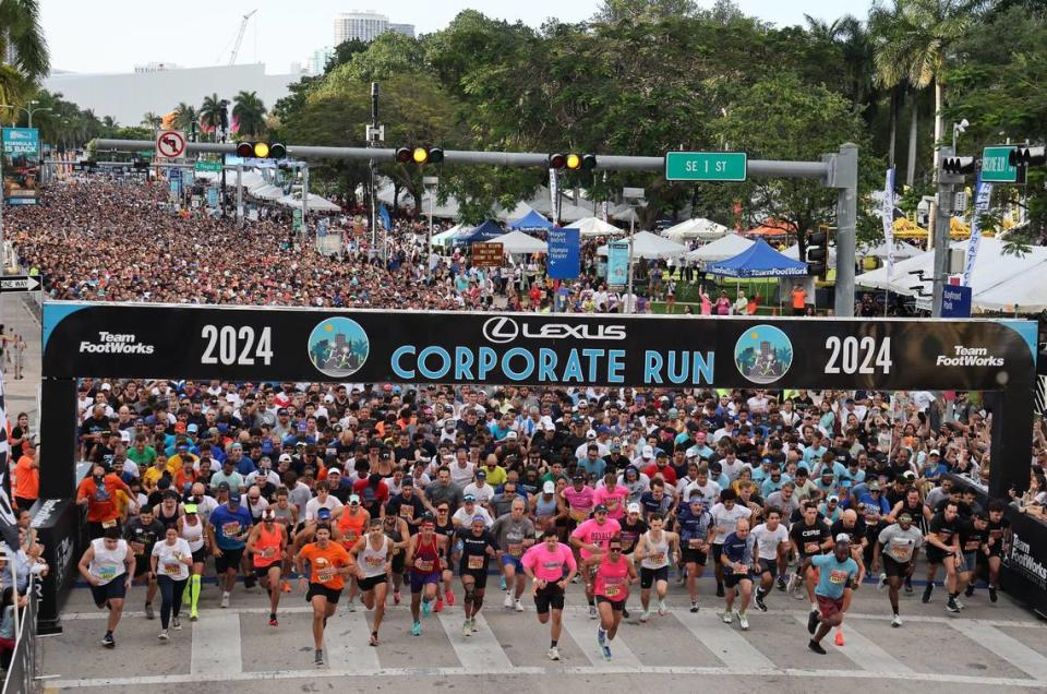 Runners take off from the starting line in front of Bayfront Park on Biscayne Boulevard heading south. The annual 5K race is referred to as “South Florida’s Largest Office Party” with over seventeen thousand registered runners and hundreds of companies represented.