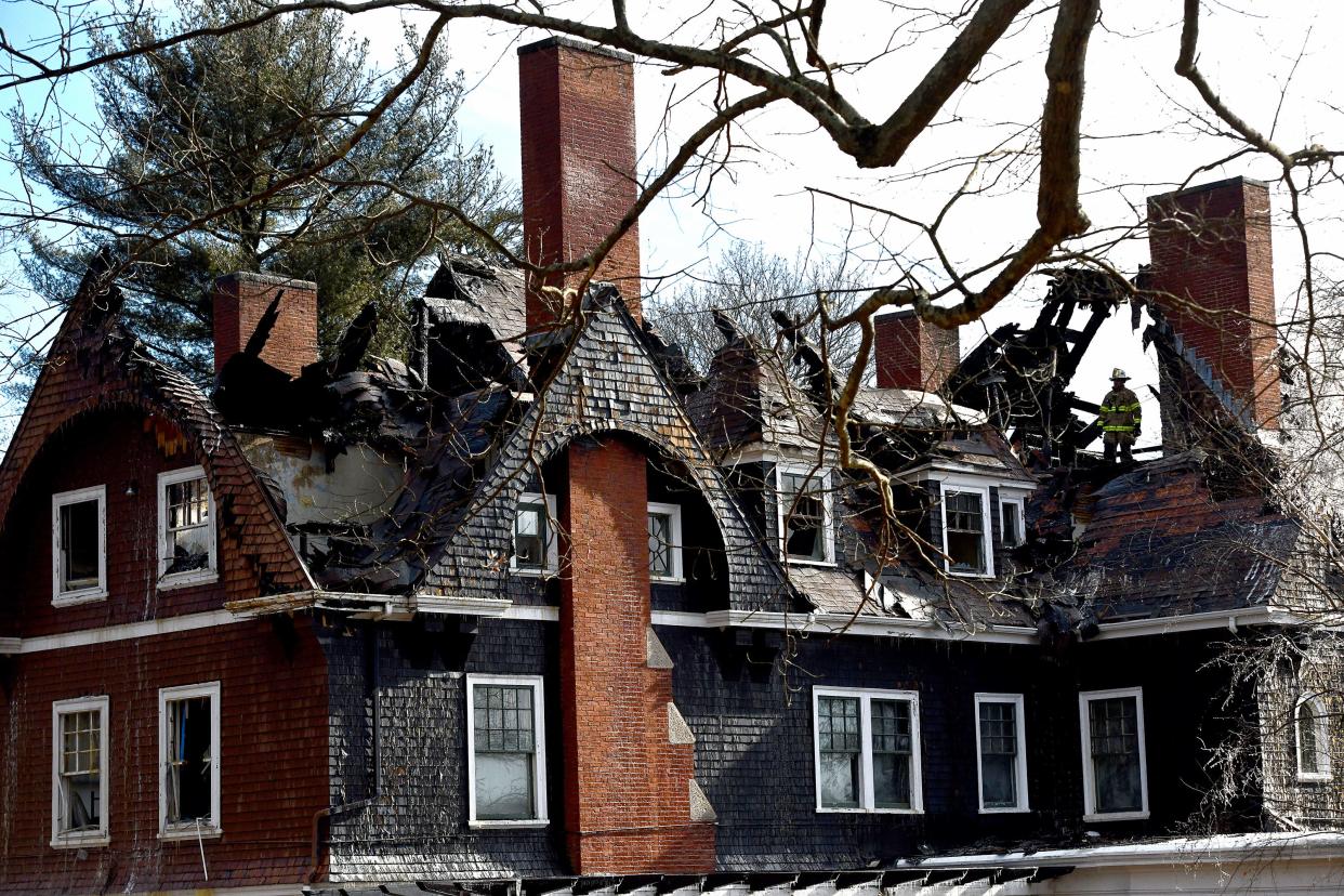 The fire-damaged Oakhurst Manor, shown Friday afternoon, hours after the fire.