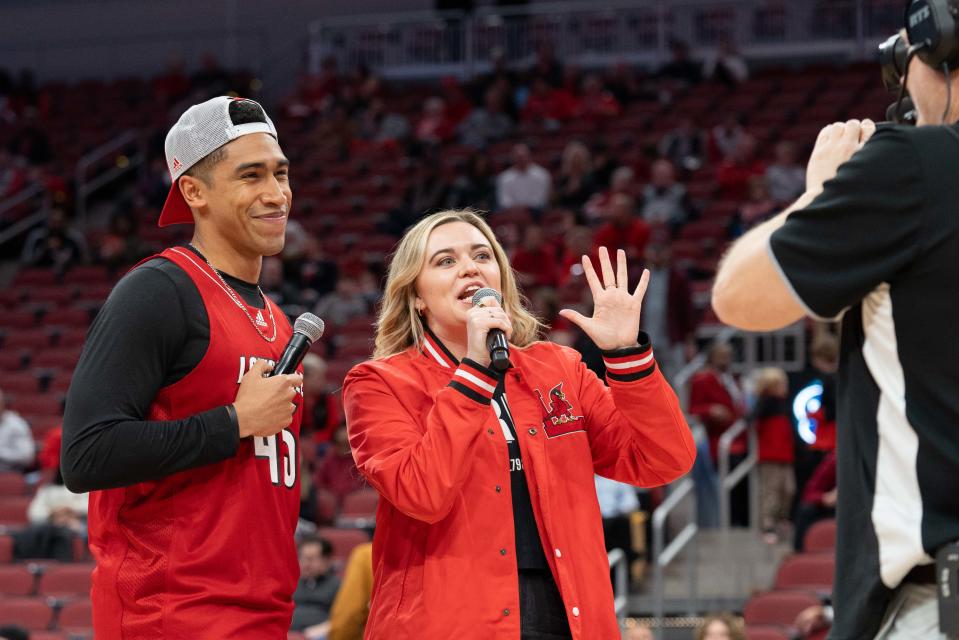 Bruce Dougherty and Allison Cook introduce the start of the men’s basketball game between the Louisville Cardinals and the Florida State Seminoles on Saturday, Feb. 3, 2024 at the KFC YUM Center in Louisville.