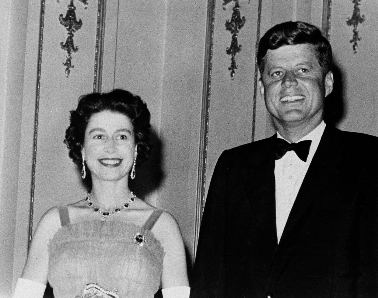 Queen Elizabeth II and President John F. Kennedy (35th president) pose at Buckingham Palace in London on June 5, 1961.  The Kennedys were dinner guests of the Queen.
