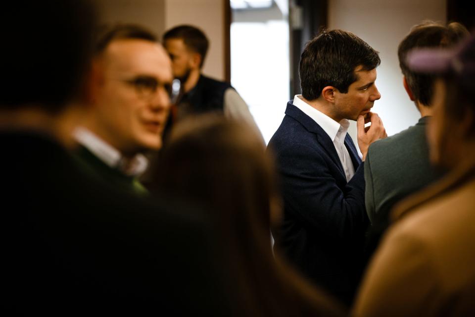 Pete Buttigieg, right, a 2020 Democratic hopeful, talks to attendees during a campaign event at Vintage Cooperative on Friday, Feb. 8, 2019, in Ankeny.