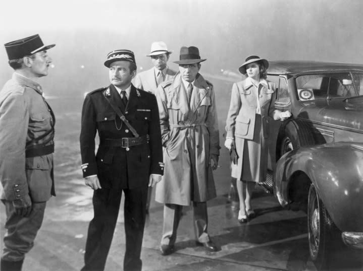 The cast of Casablanca standing.