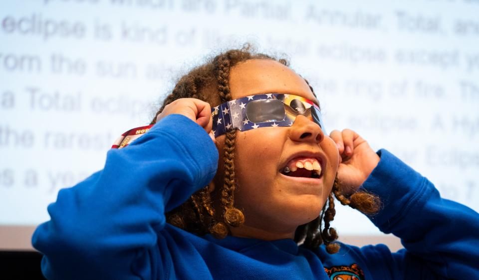 Pfluger Elementary School fifth grader Jonah Branch tests out eclipse glasses while helping teach third grade STEM class on Tuesday, April 2, 2024. Fifth graders at the Buda elementary school learned about the eclipse and created presentations to teach the third graders- including a powerpoint and a jeopardy game.