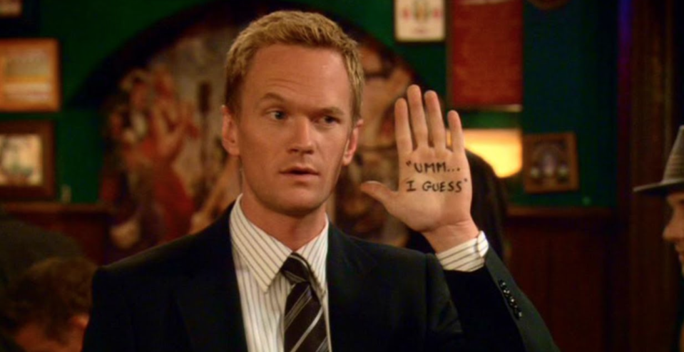Barney from "How I Met Your Mother" holds up a hand, which has "Um, I guess" handwritten on his palm