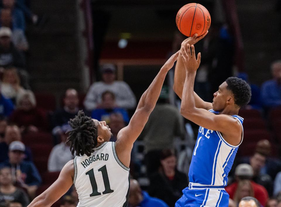 Caleb Foster of the Duke Blue Devils shoots the ball against A.J. Hoggard of the Michigan State Spartans during the first half in the 2023 State Farm Champions Classic at the United Center on November 14, 2023 in Chicago, Illinois.