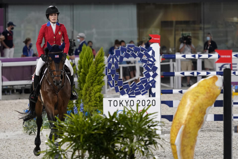 United States' Jessica Springsteen, riding Don Juan van de Donkhoeve, enters the arena to compete during the equestrian jumping individual competition during the 2020 Summer Olympics, Tuesday, Aug. 3, 2021, in Tokyo, Japan. (AP Photo/Carolyn Kaster)