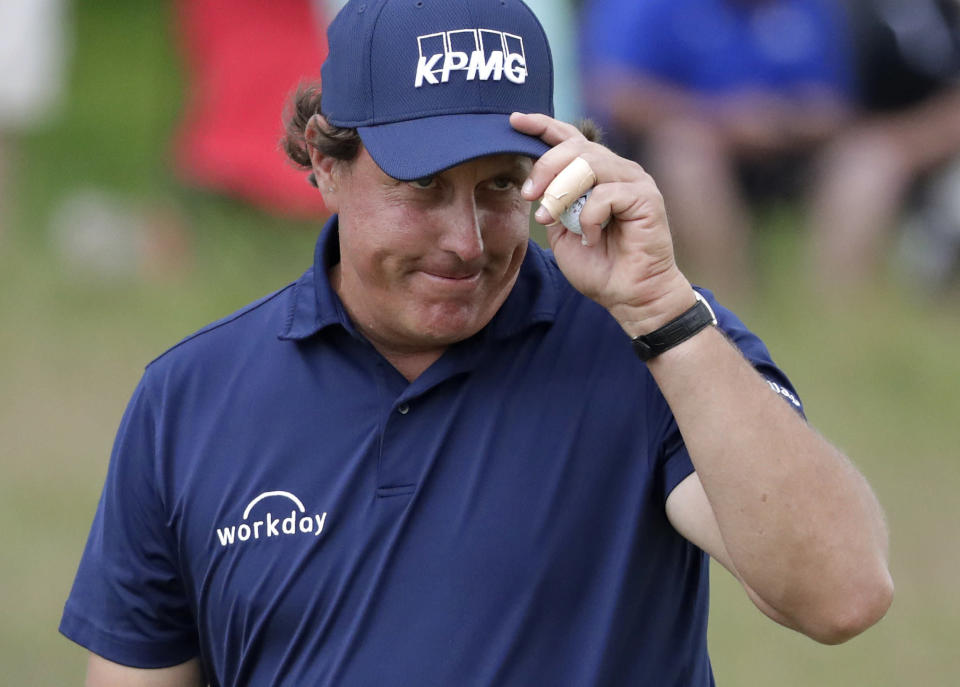 Phil Mickelson paired a wad of hundreds with a blunt response to let a critic know how he felt about "The Match." (AP)