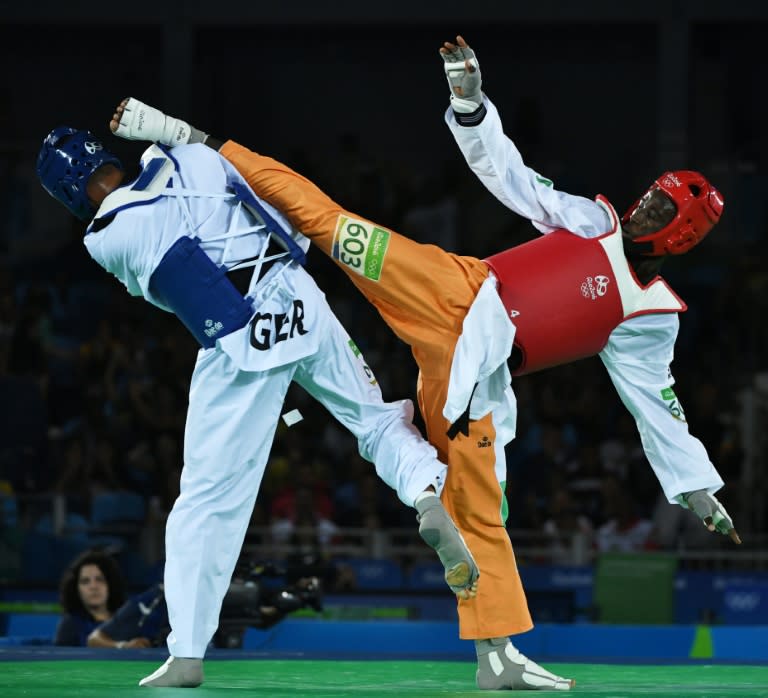 Ivory Coast's Cheick Sallah Junior Cisse (R) lands a foot on Germany's Tahir Guelec during the quarter-final in Rio 2016 Olympic Games