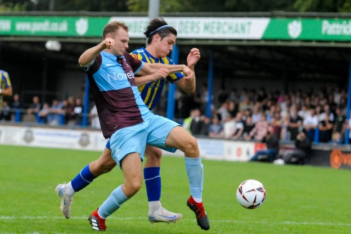 Matty McDonald battles for possession with King's Lynn's Cody Johnson <i>(Image: Sean Walsh)</i>