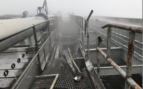 Damage is visible after a helicopter crashed on the roof of 787 Seventh Avenue at 51st Street  - Credit: Getty