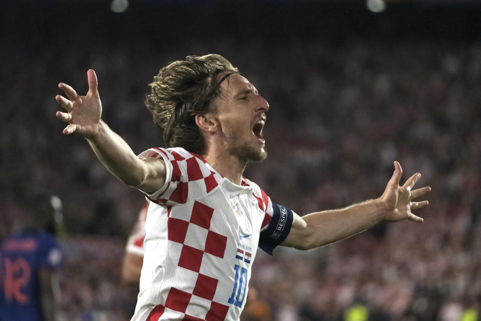 Croatia's Luka Modric celebrates after scoring his side's fourth goal against Netherlands during the Nations League semifinal soccer match between the Netherlands and Croatia at De Kuip stadium in Rotterdam, Netherlands, Wednesday, June 14, 2023. (AP Photo/Patrick Post)