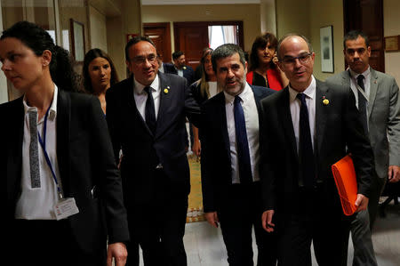 FILE PHOTO: Jailed Catalan politicians Josep Rull, Jordi Sanchez and Jordi Turull leave after getting their parliamentary credentials at Spanish Parliament, in Madrid, Spain, May 20, 2019. REUTERS/Susana Vera/File Photo