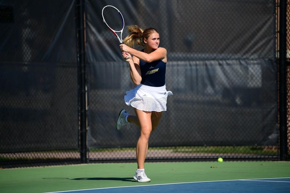 Anna Uljanov returns a serve during a match for the Akron women's tennis team, which was cut in 2020.
