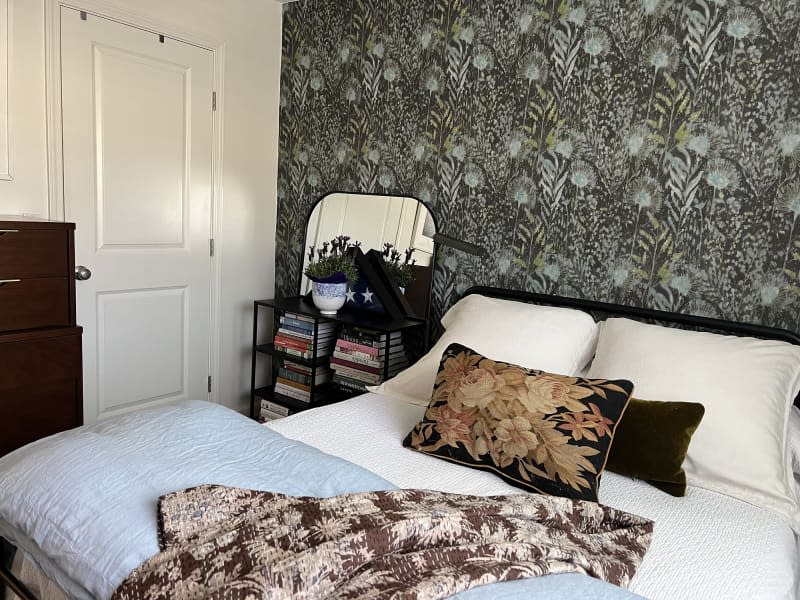 Bedroom with botanical wallpaper and other floral details