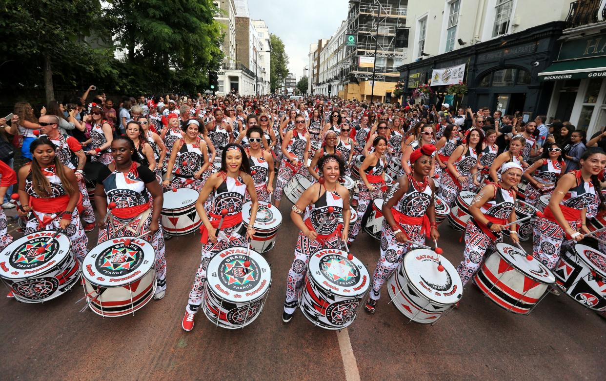 Notting hill carnival drummers storm through west London.