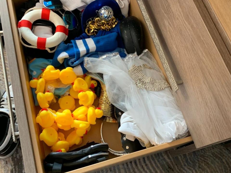 a drawer of rubber ducks and accessories