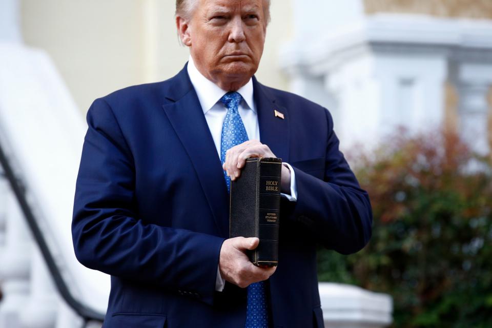 President Donald Trump holds a Bible outside St. John's Church in Washington, D.C., on Monday night. Faith leaders say they were among those who were tear-gassed by federal police clearing the area for the photo-op. (AP Photo/Patrick Semansk)